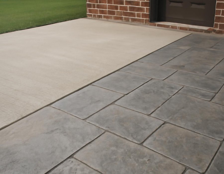 AI concept: Broom-finished concrete patio next to a stamped slate-pattern patio