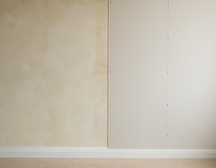 AI concept: Plaster wall repaired and skimmed on the left, wall replaced with new drywall on the right