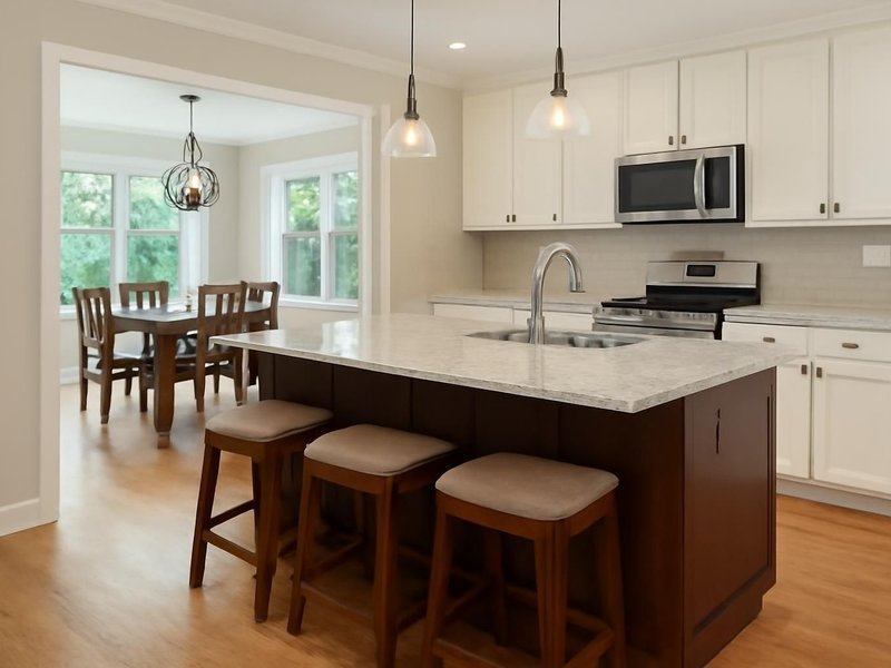 AI concept: Remodeled idea: wall removed, island with seating, open to the dining room