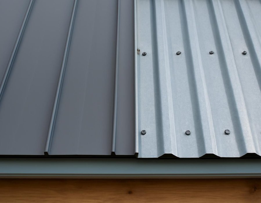 AI concept: Standing seam metal panel beside an exposed fastener panel showing its screws
