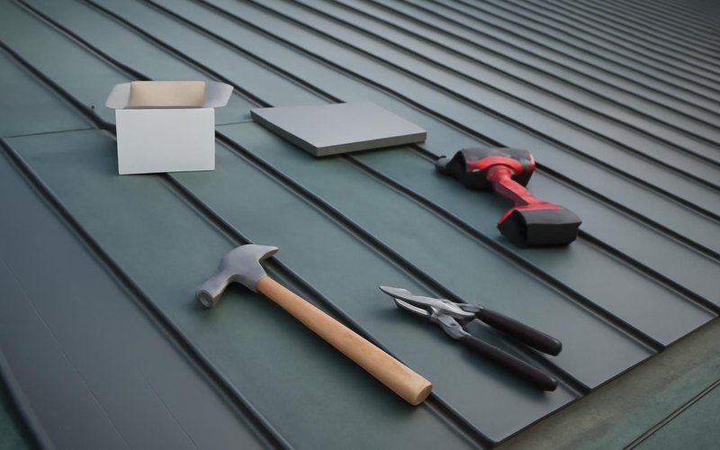AI concept: Crew installing standing seam panels over underlayment