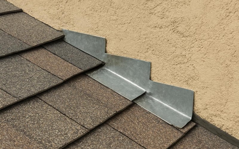 AI concept: Step flashing woven into shingles along a wall