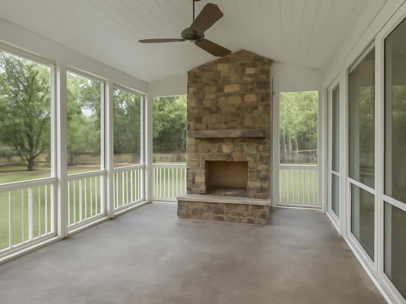 AI concept: Remodeled idea: screened porch with a stone fireplace and removable winter panels