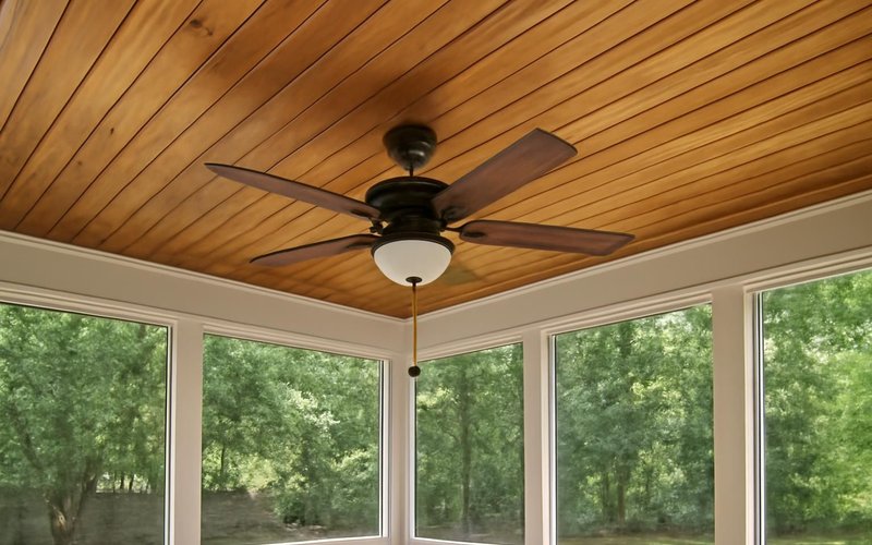 AI concept: Stained tongue-and-groove porch ceiling with a fan