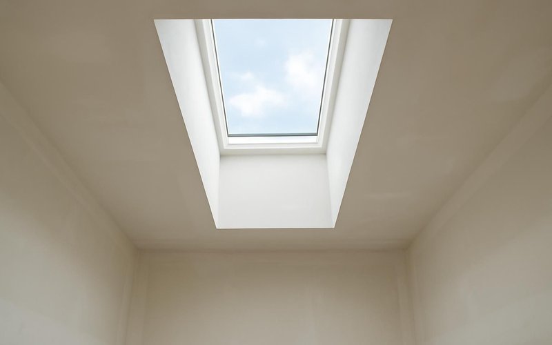 Finished drywall light shaft under a new skylight