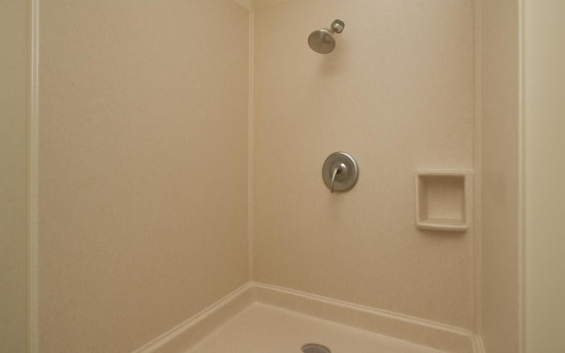 AI concept: Solid surface wall panels in a converted shower