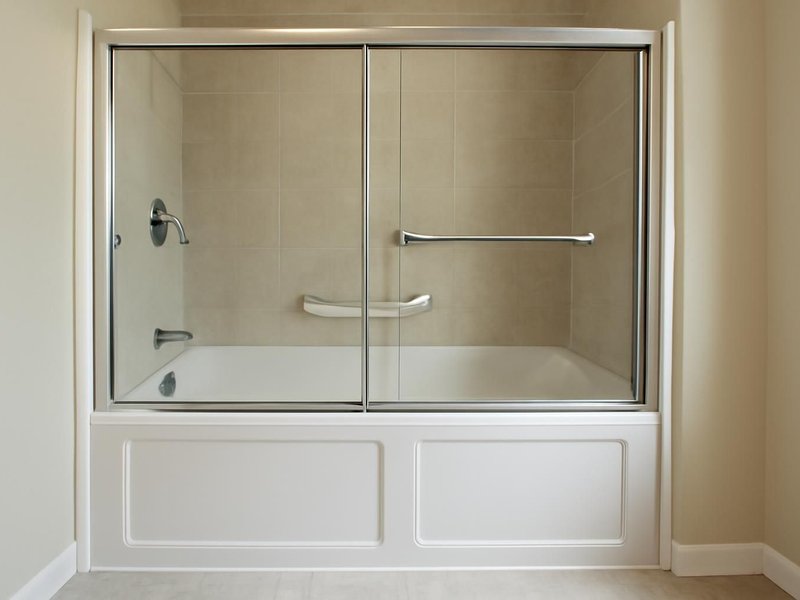 AI concept: Existing condition: standard tub with a sliding glass door and a suction grab bar