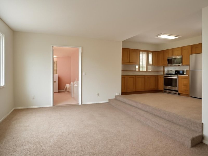 Before: split-level with pink tile baths, carpet and an oak kitchen